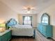 Spacious bedroom with light flooring and teal furniture at 2130 Sequoia Way, Davenport, FL 33896