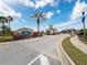 Gated community entrance with brick pavers and landscaping at 2130 Sequoia Way, Davenport, FL 33896