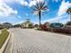 Sereno community entrance with gated entry and brick pavers at 2130 Sequoia Way, Davenport, FL 33896