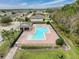 Community pool with adjacent covered seating area at 2130 Sequoia Way, Davenport, FL 33896