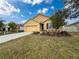 Single-story house with attached garage and landscaped lawn at 2130 Sequoia Way, Davenport, FL 33896