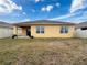 Back exterior of house showcasing a large yard at 2130 Sequoia Way, Davenport, FL 33896