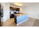 Modern kitchen with island, stainless steel appliances, and dark wood cabinets at 2130 Sequoia Way, Davenport, FL 33896