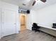 Home office with desk, chair and storage at 2130 Sequoia Way, Davenport, FL 33896