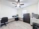 Home office with desk, chair and storage at 2130 Sequoia Way, Davenport, FL 33896