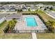Community pool and patio area with adjacent homes at 2130 Sequoia Way, Davenport, FL 33896