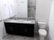 Bathroom with granite double vanity and toilet at 2180 Nighthawk Dr, Haines City, FL 33844