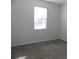 Bedroom with window and carpet at 2180 Nighthawk Dr, Haines City, FL 33844