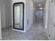 Bright entryway with tile flooring and large mirror at 2180 Nighthawk Dr, Haines City, FL 33844