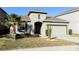 Single-story house with attached garage and landscaped front yard at 2180 Nighthawk Dr, Haines City, FL 33844