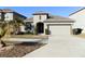 Single-story house with attached garage and landscaped front yard at 2180 Nighthawk Dr, Haines City, FL 33844