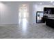 Spacious living room with tile flooring and view of kitchen at 2180 Nighthawk Dr, Haines City, FL 33844