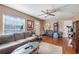 Living room with a gray couch and wood floors at 2259 Minnesota Ave, Winter Park, FL 32789