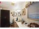 Bathroom with double sink, medicine cabinet, and window at 6055 Grand Oaks Se Dr, Winter Haven, FL 33884