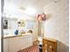 Bathroom with double vanity, shower, and decorative rug at 6055 Grand Oaks Se Dr, Winter Haven, FL 33884