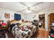 Main bedroom with double bed, ceiling fan, and ample closet space at 6055 Grand Oaks Se Dr, Winter Haven, FL 33884