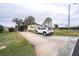 Mobile home with paved driveway and landscaping at 6055 Grand Oaks Se Dr, Winter Haven, FL 33884