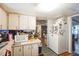 Bright kitchen with white appliances and lots of counter space at 6055 Grand Oaks Se Dr, Winter Haven, FL 33884