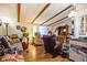 Cozy living room features wood floors and large windows at 6055 Grand Oaks Se Dr, Winter Haven, FL 33884