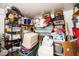 Storage area with various boxes, shelving, and personal items at 6055 Grand Oaks Se Dr, Winter Haven, FL 33884
