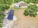 Aerial view showing house, solar panel, and large oak tree at 2715 Sw 177Th Place Rd, Ocala, FL 34473