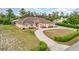 One-story house with a large yard and circular driveway at 2715 Sw 177Th Place Rd, Ocala, FL 34473