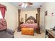 Bedroom with a four-poster bed and carpeted floors at 2715 Sw 177Th Place Rd, Ocala, FL 34473