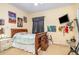bedroom with a full-size bed and wall decor at 2715 Sw 177Th Place Rd, Ocala, FL 34473