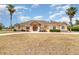 Single-story house with stone accents and a large yard at 2715 Sw 177Th Place Rd, Ocala, FL 34473