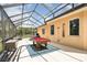 Enclosed patio with pool table and wooded views at 2715 Sw 177Th Place Rd, Ocala, FL 34473