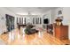 Large living area with wood flooring and a fireplace at 2715 Sw 177Th Place Rd, Ocala, FL 34473