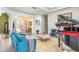 Spacious living room with a grand piano, sitting area, and entryway at 2715 Sw 177Th Place Rd, Ocala, FL 34473