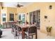 Outdoor patio with a large table and seating at 2715 Sw 177Th Place Rd, Ocala, FL 34473