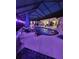 Night view of a pool and spa with covered patio at 2715 Sw 177Th Place Rd, Ocala, FL 34473