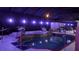 Night view of a pool and spa with covered patio at 2715 Sw 177Th Place Rd, Ocala, FL 34473