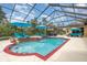 Large screened pool and spa with multiple lounge chairs at 2715 Sw 177Th Place Rd, Ocala, FL 34473