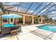 Enclosed pool and patio area with seating at 2715 Sw 177Th Place Rd, Ocala, FL 34473