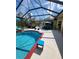 Pool and spa area with covered patio and lounge chairs at 2715 Sw 177Th Place Rd, Ocala, FL 34473