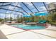 Pool area with lounge chairs and umbrellas at 2715 Sw 177Th Place Rd, Ocala, FL 34473