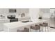 Modern kitchen with gray cabinets, white countertops, and stainless steel appliances at 4807 Waltham Forest Dr, Davenport, FL 33837
