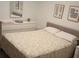 Cozy bedroom featuring a comfortable bed with floral patterned bedding and a white dresser at 621 San Augusto Dr, Poinciana, FL 34759