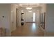 Inviting foyer with decorative mirrors, tile floors, and elegant lighting fixtures at 621 San Augusto Dr, Poinciana, FL 34759
