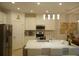 Bright kitchen featuring stainless appliances, a kitchen island, and contemporary pendant lighting at 621 San Augusto Dr, Poinciana, FL 34759