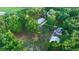 Aerial view of home, detached garage, and expansive green space at 1528 Walker Rd, Lakeland, FL 33810