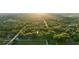 Aerial view of property showing home nestled in lush trees at 1528 Walker Rd, Lakeland, FL 33810