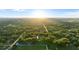 Aerial view of property, showing home's location on a wooded lot at 1528 Walker Rd, Lakeland, FL 33810