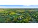 Aerial view of home situated on a large lot with pond nearby at 1528 Walker Rd, Lakeland, FL 33810