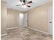Spacious bedroom with tile floors and ceiling fan at 1528 Walker Rd, Lakeland, FL 33810