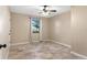 Simple bedroom with tile flooring and window with view at 1528 Walker Rd, Lakeland, FL 33810