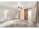 Bright bedroom with tile flooring and barn door to closet at 1528 Walker Rd, Lakeland, FL 33810